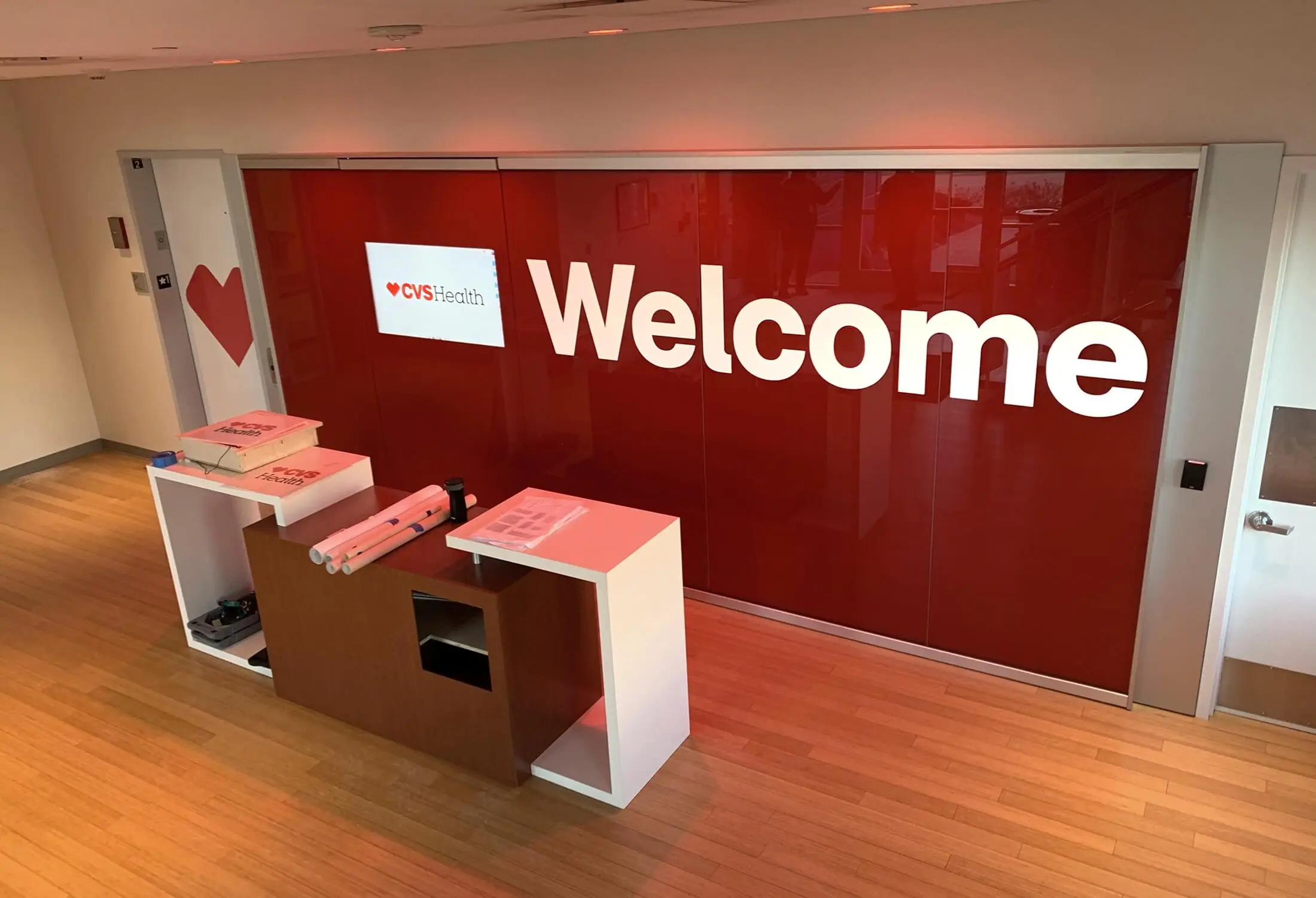Red “Welcome” reception wall