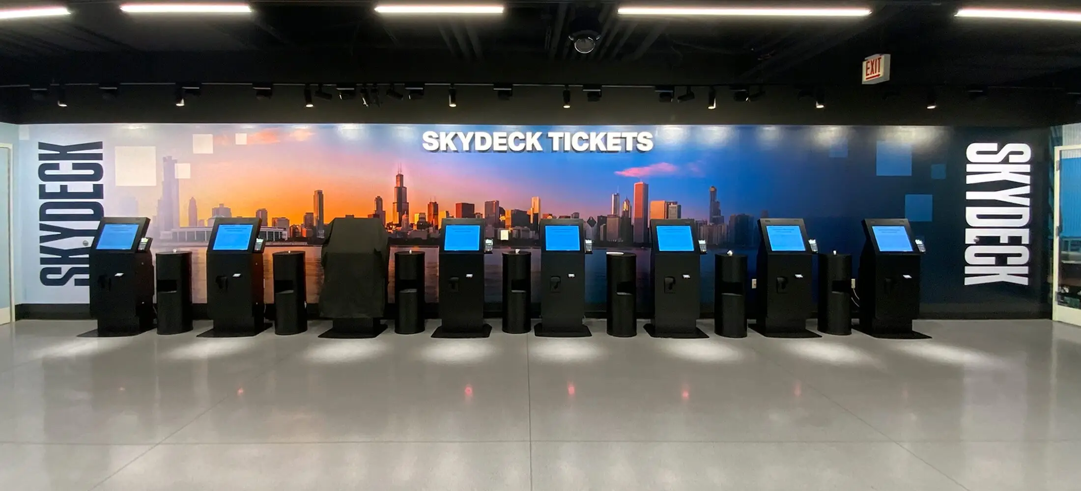 Skydeck ticketing lobby with a skyline mural